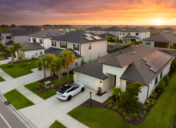 American gated community houses in rural US suburbs. View from above of large residential homes in small town in southwest Florida American gated community houses in rural US suburbs. View from above of large residential homes in small town in southwest Florida.