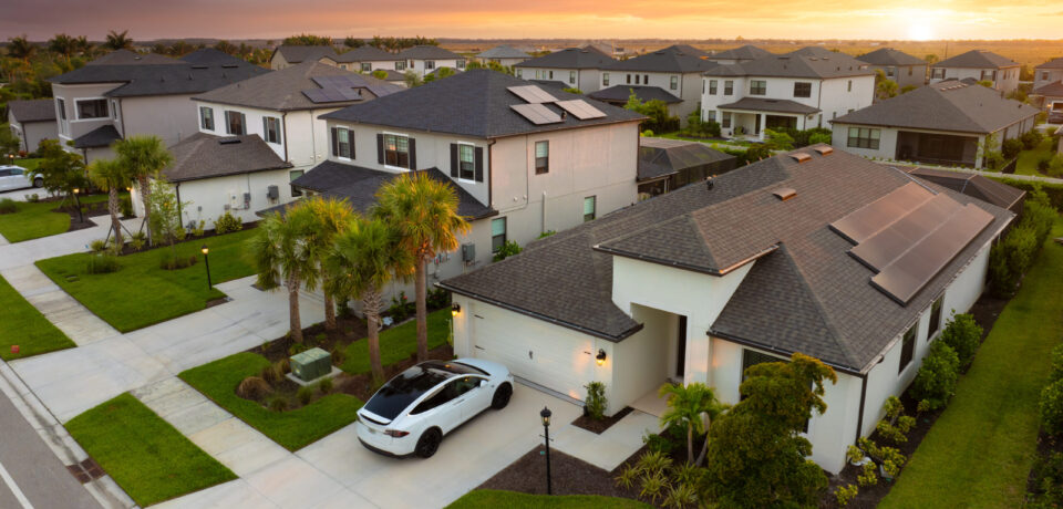 American gated community houses in rural US suburbs. View from above of large residential homes in small town in southwest Florida American gated community houses in rural US suburbs. View from above of large residential homes in small town in southwest Florida.