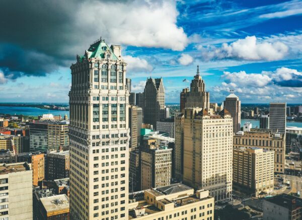 Cityscape of Detroit under the sunlight and a dark cloudy sky at daytime in Michigan in the US A cityscape of Detroit under the sunlight and a dark cloudy sky at daytime in Michigan in the US